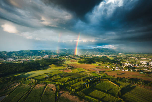 rainbow over the landscape stock photo