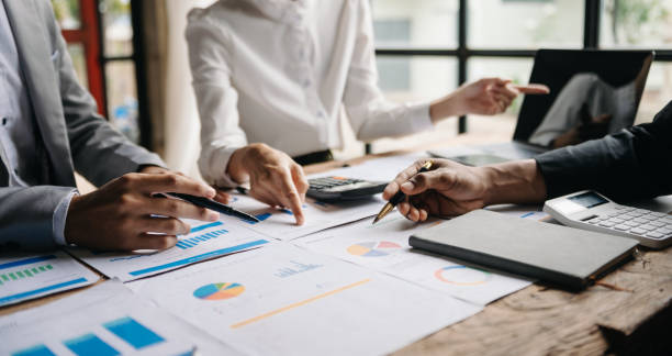 istock Business People Planning Strategy Analysis Office Concept. writing notes about sticky notes Laptop,tablet  Planning and Brainstorming Strategies of Colleagues 1491192025