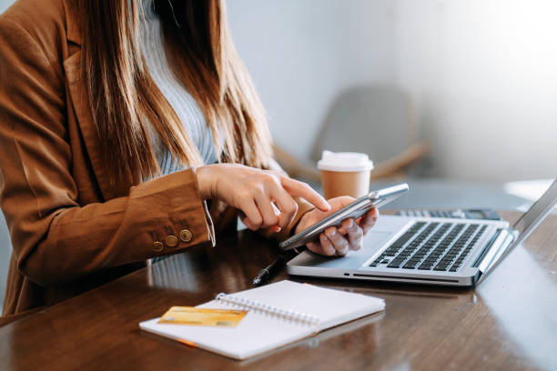 istock businesswoman hand working with new modern computer and writing on the notepad strategy diagram as concept 1491192039