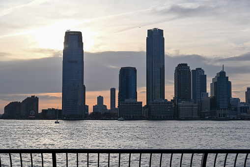 New York, USA, April 11, 2023 - View from Brookfield Place / Battery Park, Manhattan to Jersey City skyline with Goldman Sachs Tower.