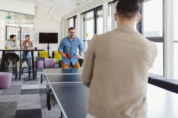 istock Business People Have Fun Playing Ping Pong 1491194452