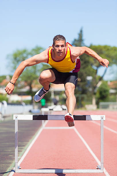istock Male Track and Field Athlete during Obstacle Race 149119497