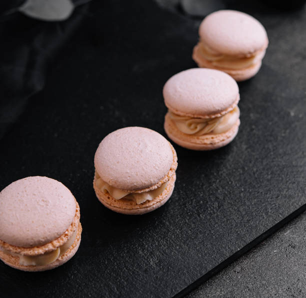 istock Delicate crumbly delightful pink macaroons close up 1491196631