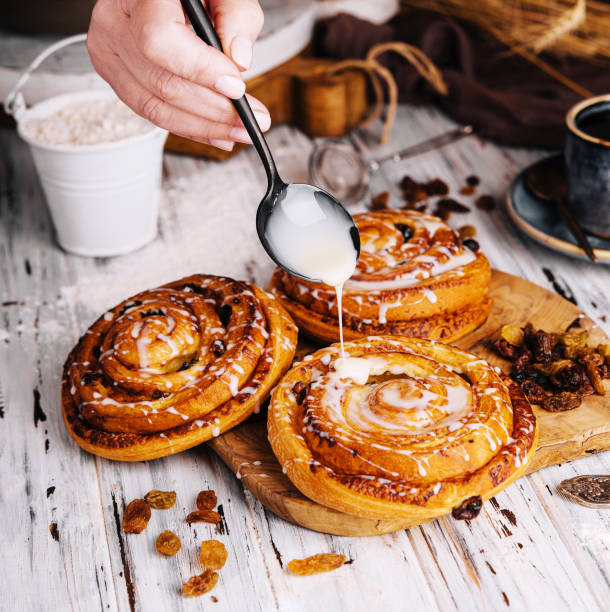 istock Homemade raisin roll pastry with vanilla icing 1491200181