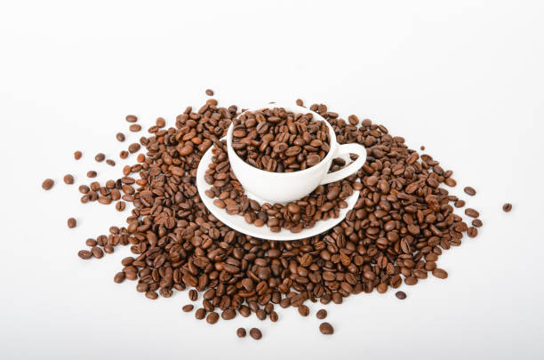 istock Cup of coffee and roasted coffee beans on white background 1491201404
