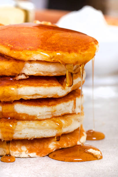 istock syrup dripping of pancakes 1491201514