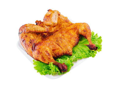roast chicken served on a white platter