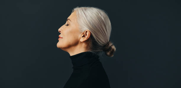 istock Side view of an empowered senior woman standing in studio 1491204456