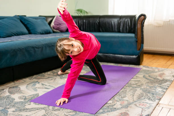 istock Child exercising at home 1491206944