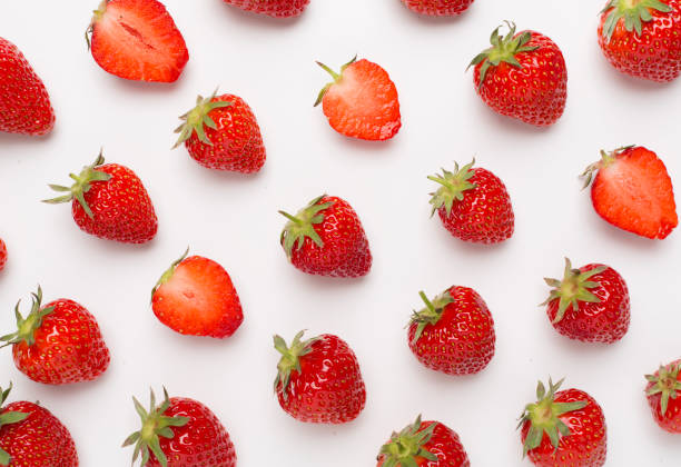 istock Strawberries with leaves on white background, top view 1491206992