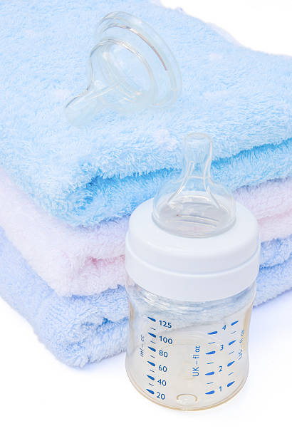 istock baby bottle and towels with clipping path 149120734