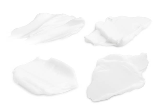 istock A set of different strokes of white cream on a white background. 1491210580