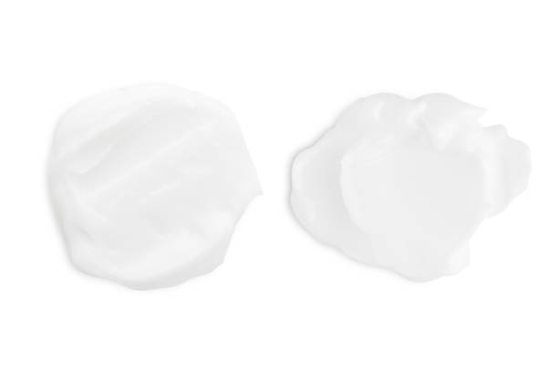 istock A set of different strokes of white cream on a white background. 1491210581