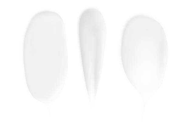 istock A set of different strokes of white cream on a white background. 1491211262