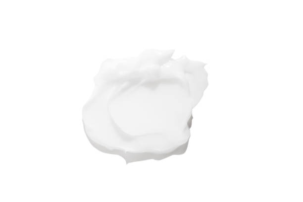 istock A smear of white cream on a white background. 1491211412
