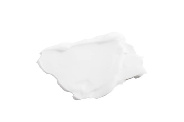 istock A smear of white cream on a white background. 1491211414