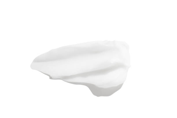 istock A smear of white cream on a white background. 1491211475