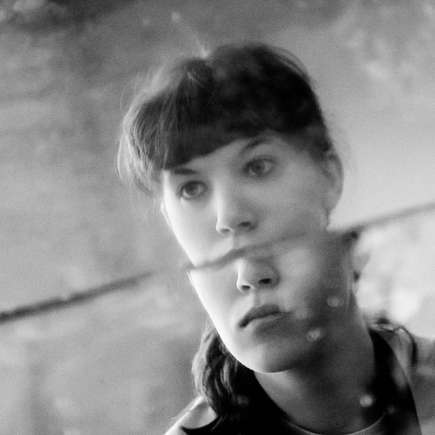 istock Young woman portrait reflected in shattered mirror, black and white 1491212715