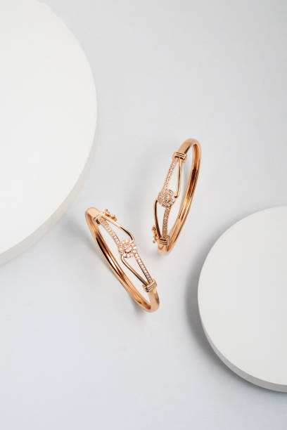 istock Top view of golden bracelet on white dramatic background with copy space 1491213858