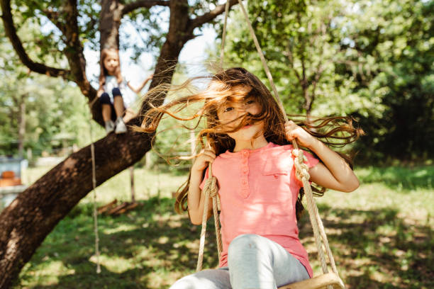 istock Children climbing and swinging in the yard 1491215651
