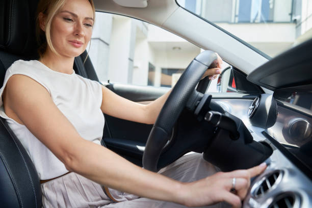 istock Caucasian woman starts the car engine 1491217037