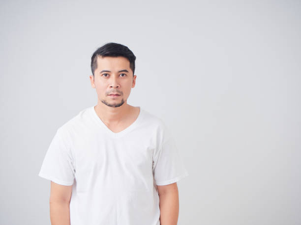 istock Portrait of handsome young man on light background 1491217586