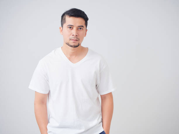 istock Portrait of handsome young man on light background 1491217611