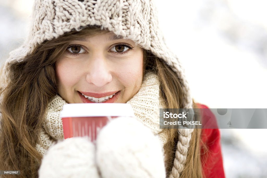 Woman holding hot coffee on winter day Adult Stock Photo