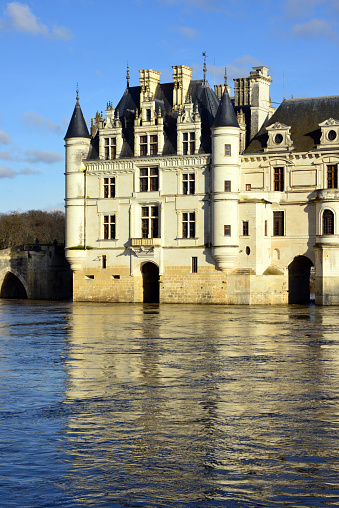 Chenonceaux,France - November 10, 2015: Chateau de Chenonceau Loire Valley France at sunset with reflection of building and sky in the River Cher