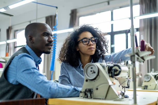 istock Skilled experienced African American designers in their professional atelier. 1491222478