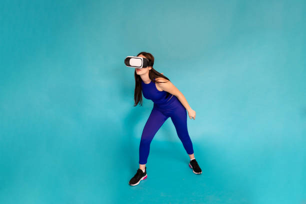 istock Woman exercising with vr glasses. 1491223831