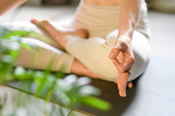istock Woman practicing yoga at home 1491226514