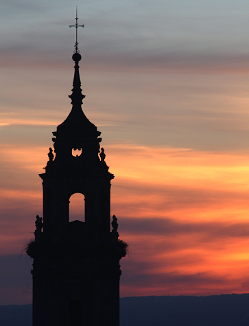 Church tower against cloudy sky during sunset. Las Salinas, Cabo de Gata Nature Park, Almeria, Spain