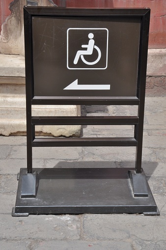 Signage for access by wheelchair users.