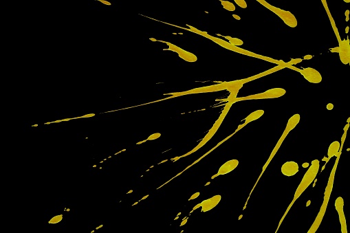 Yellow colorful fluorescent splashes or streaks on black background,Art abstract texture,Abstract color,Abstract Textures