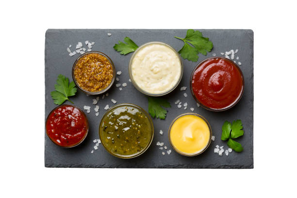 istock Many different sauces and herbs isolated on white background, flat lay top view. sauces on plate, healthy concept 1491233048