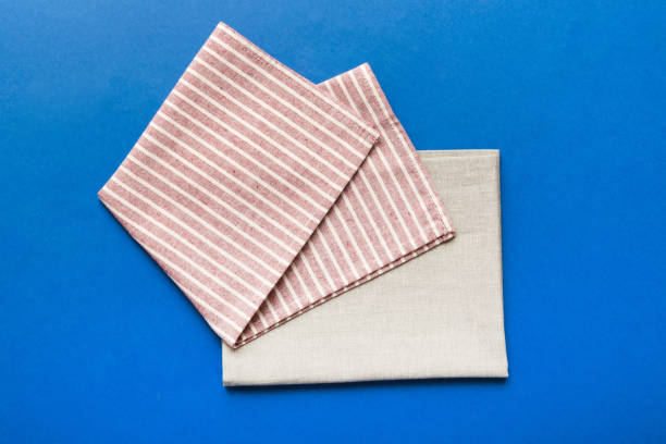 istock top view with red empty kitchen napkin isolated on table background. Folded cloth for mockup with copy space, Flat lay. Minimal style 1491233158