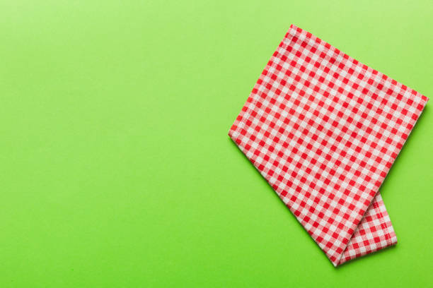 Empty Picnic table, Red and white checkered tablecloth. Wood texture  Knotted wood wall in  backgrounds