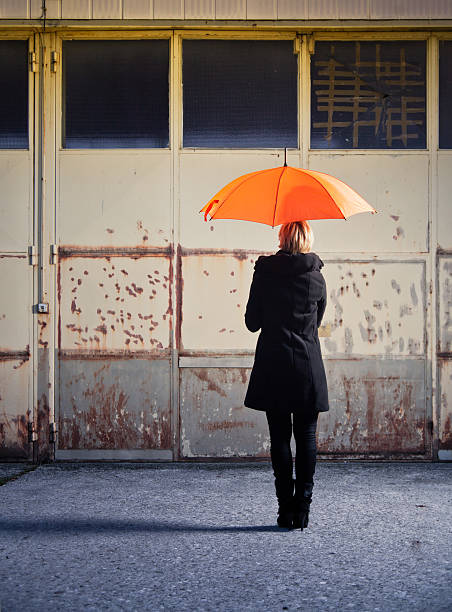 istock Woman with umbrella 149123506