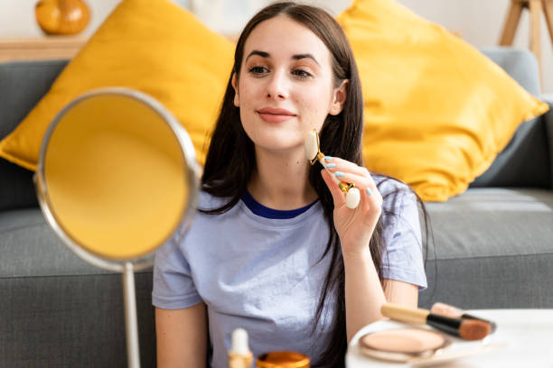 istock Woman massaging her face with a quartz roller. 1491236526