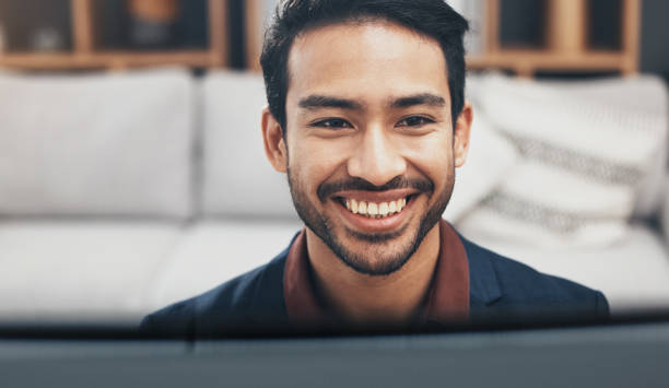 istock Work from home, happy man and computer for remote job opportunity, smile for video call or business communication. Professional asian person or freelancer worker working online with career happiness 1491237628