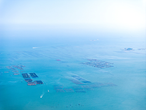Aerial photograph of aquaculture floating at sea