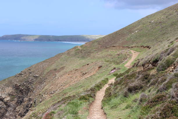 istock Coastal path winding along a cliff with stunning sea views in sunshine 1491242066