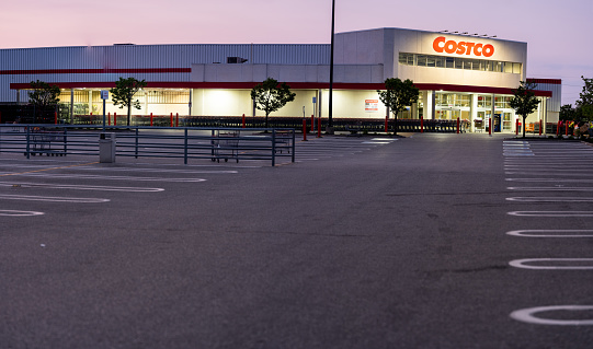 Windsor, Ontario, Canada - May 16, 2023:  The Costco in Windsor, Ontario shown after hours with an empty parking lot and various shopping carts that have not yet been put away.