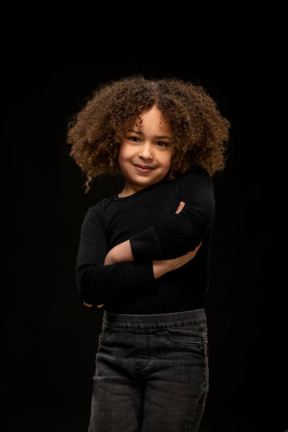 Beautiful young black girl posing for studio portrait
