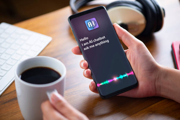 AI chatbot on smart phone screen Hand holding a smart phone displaying artificial intelligence assistant, A.I.. chat gpt stock pictures, royalty-free photos & images