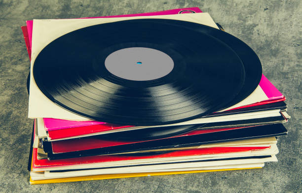 istock Vintage vinyl record on grunge background, retro toned. 1491250258