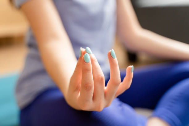 istock Young woman doing mudra gesture at home. 1491250270