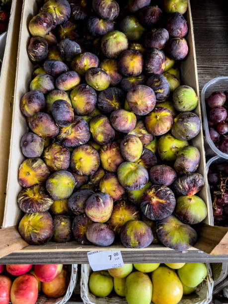 istock Fresh figs lie in a box on the market 1491250521
