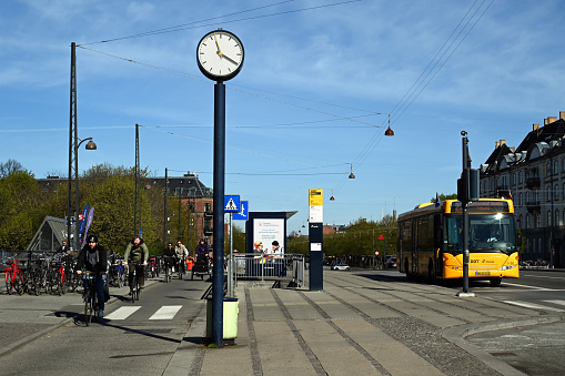 Copenhagen, Denmark,may 9, 2023 : Buses and bicycles on a Copenhagen boulevard in Denmark